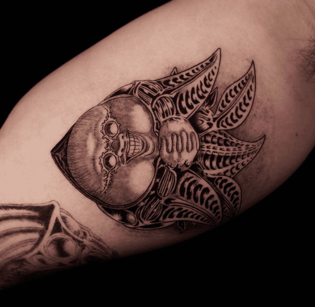 Ubik Smile Beserk Tattoo