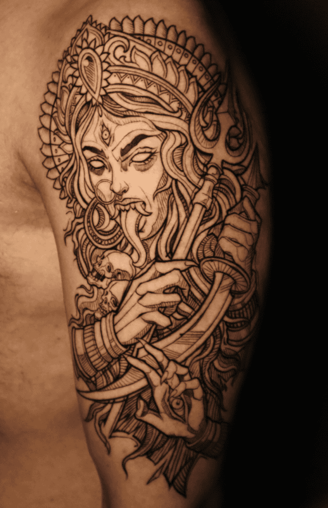 Intricate Kali tattoo with multiple arms.